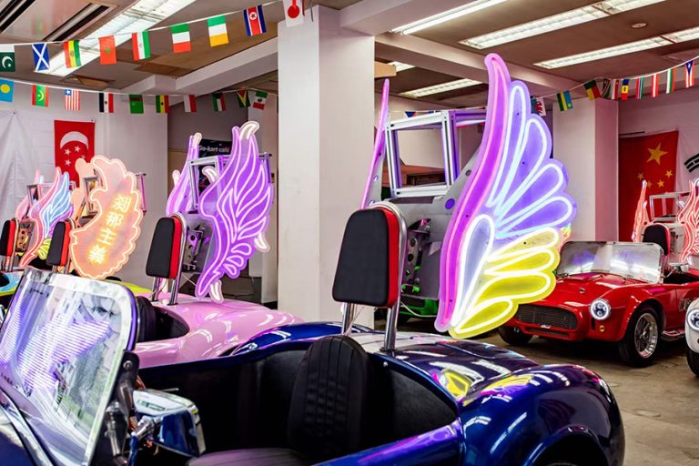 Go Karting Osaka for Beginners: From Briefing to Return Illuminated electric go-karts lined up for a W Go-Kart Osaka guided departure